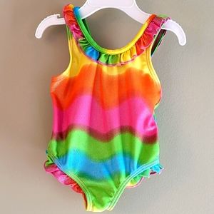Shiny brightly colored one piece swimsuit